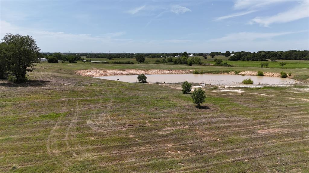 8605 West Highway 199 Springtown, TX 76082 - Photo 21 of 23 Expansive acreage featuring a natural pond, mature trees, and varied topography