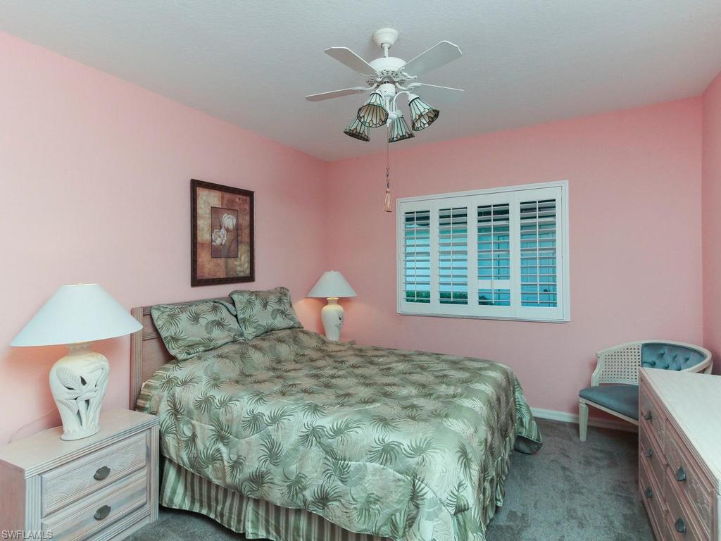550 Gabriel Circle, Unit 3111 Naples, FL 34104 - Photo 2 of 25 a bedroom with a bed and a window