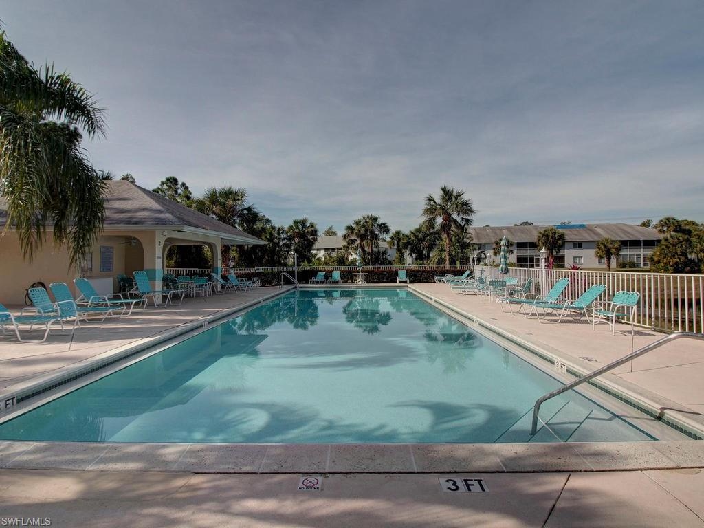 550 Gabriel Circle, Unit 3111 Naples, FL 34104 - Photo 23 of 25 swimming pool view with a seating space