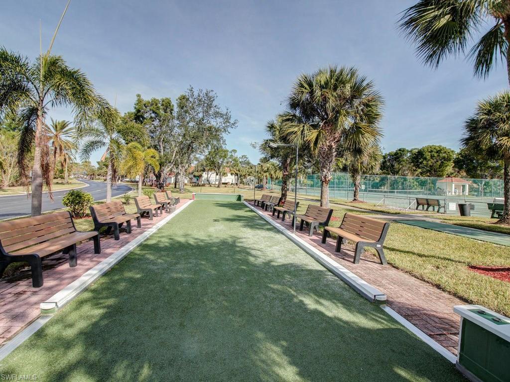 550 Gabriel Circle, Unit 3111 Naples, FL 34104 - Photo 24 of 25 a view of a swimming pool with a lounge chairs