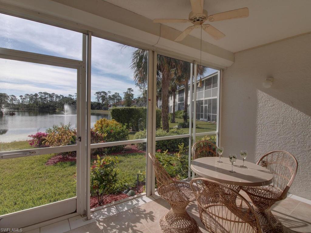 550 Gabriel Circle, Unit 3111 Naples, FL 34104 - Photo 5 of 25 a view of a porch with furniture and yard