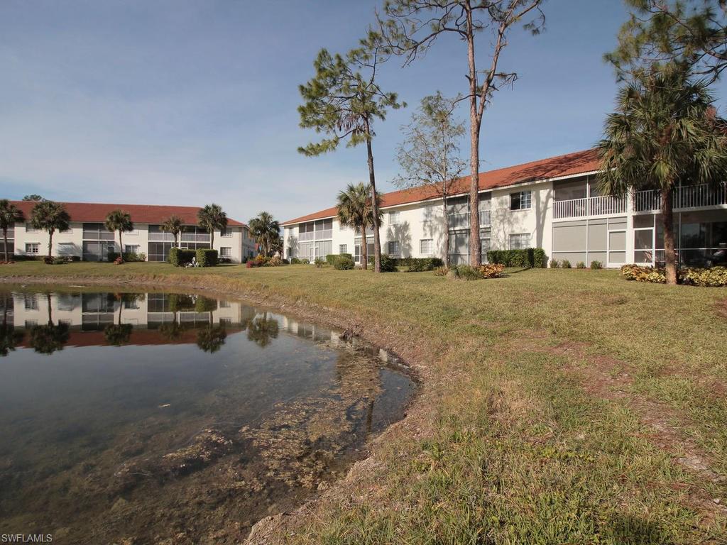 550 Gabriel Circle, Unit 3111 Naples, FL 34104 - Photo 6 of 25 a view of a house with a yard and pathway
