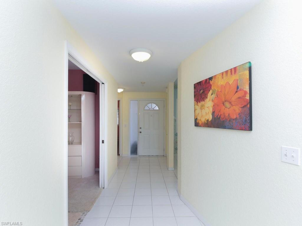 550 Gabriel Circle, Unit 3111 Naples, FL 34104 - Photo 7 of 25 a view of a hallway with closet