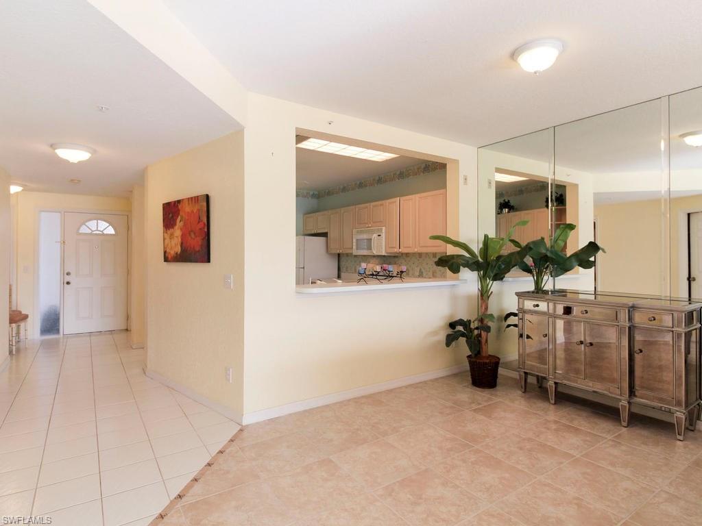 550 Gabriel Circle, Unit 3111 Naples, FL 34104 - Photo 8 of 25 a bathroom with a sink and a mirror