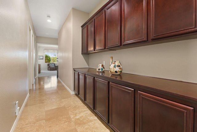 a hallway with cabinets