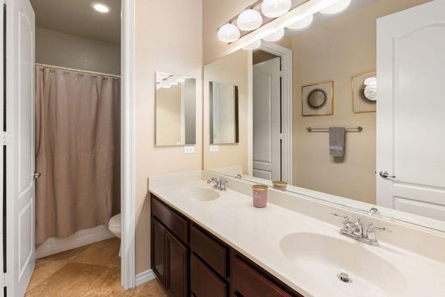 a bathroom with a double vanity sink mirror and double