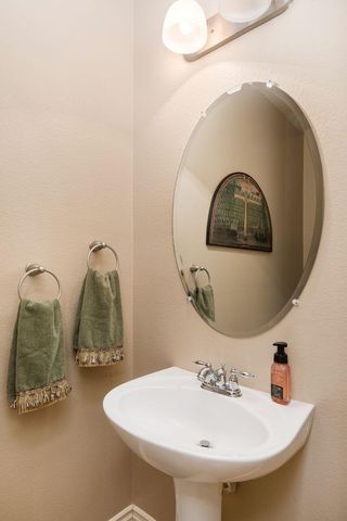 a bathroom with a sink and mirror