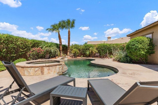 a view of a swimming pool with a patio