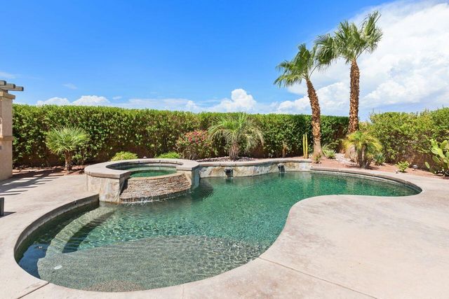 a view of a swimming pool with a patio