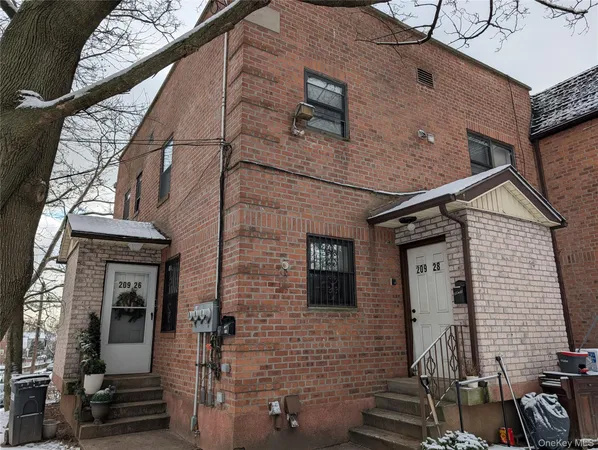 a view of a brick house with many windows