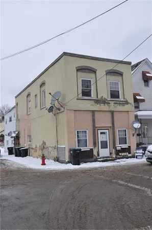 a view of a street that has couple of cars parked on the road