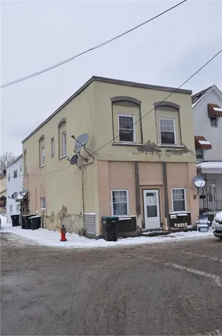 a view of a street that has couple of cars parked on the road