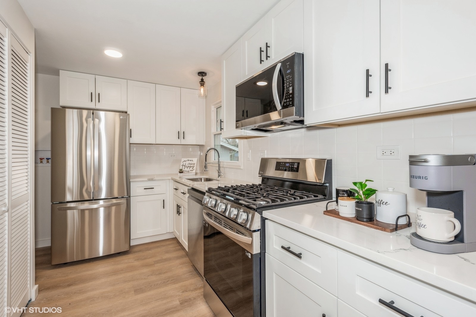 324 Springinsguth Road Schaumburg, IL 60193 - Photo 2 of 10 a kitchen with stainless steel appliances a stove microwave and refrigerator