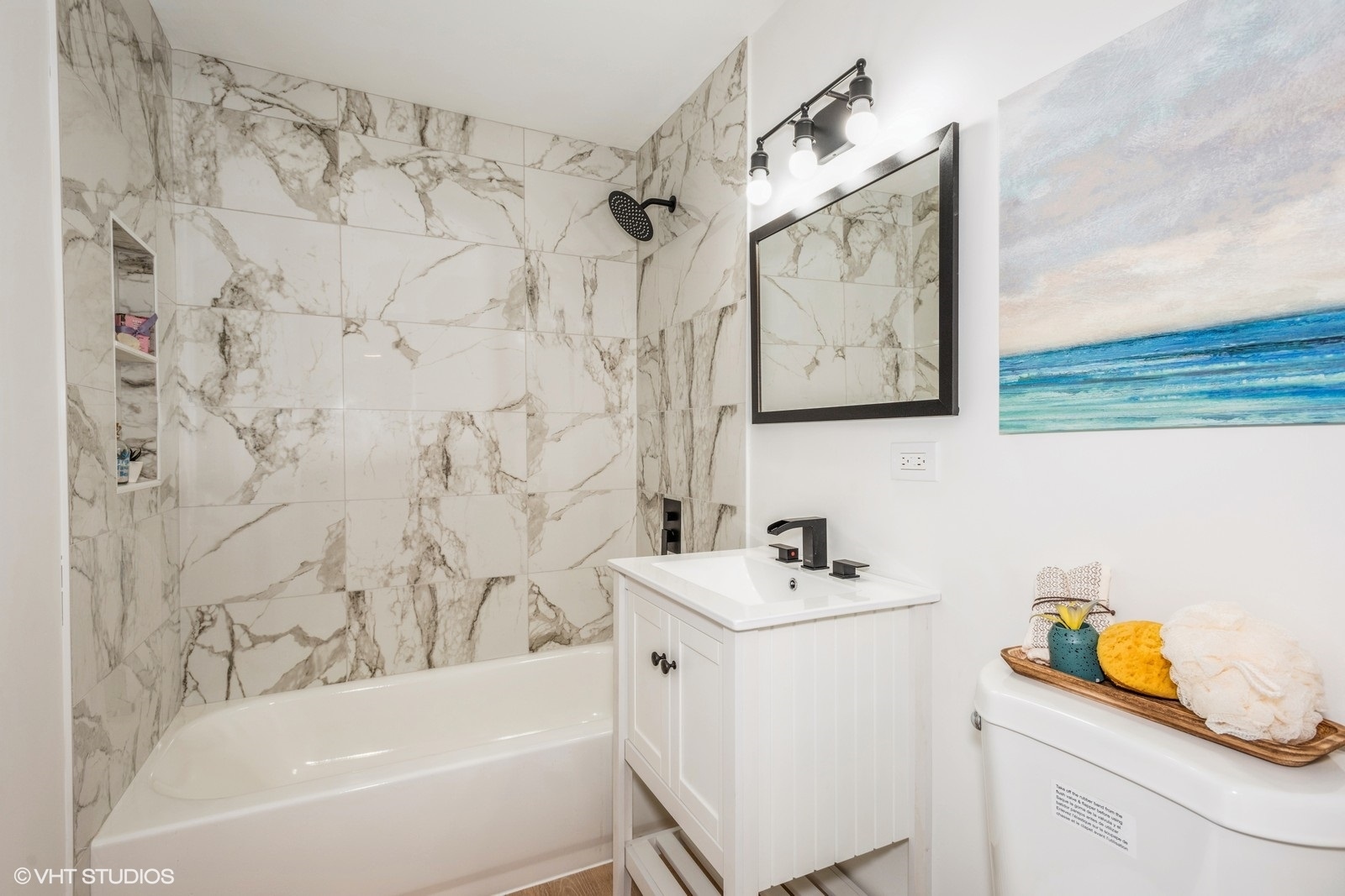 324 Springinsguth Road Schaumburg, IL 60193 - Photo 6 of 10 a bathroom with a sink mirror vanity and bathtub