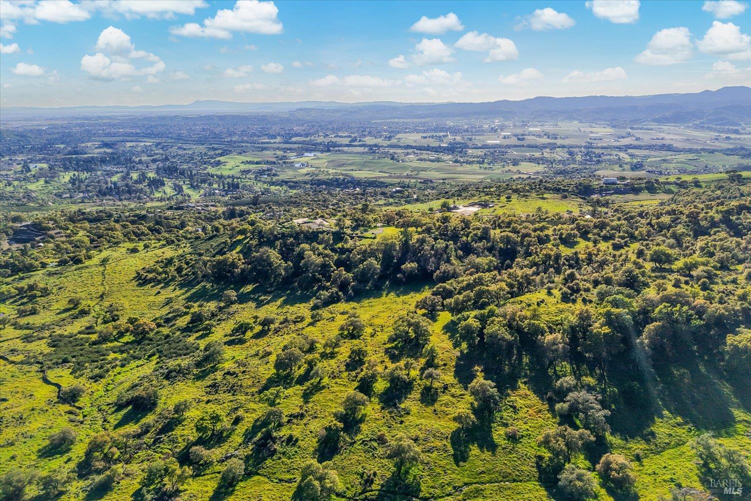 2355 Atlas Peak Road Napa, CA 94558 - Photo 13 of 24 Aerial view looking west over North Napa and towards Marin and the Mayacamas Mountains