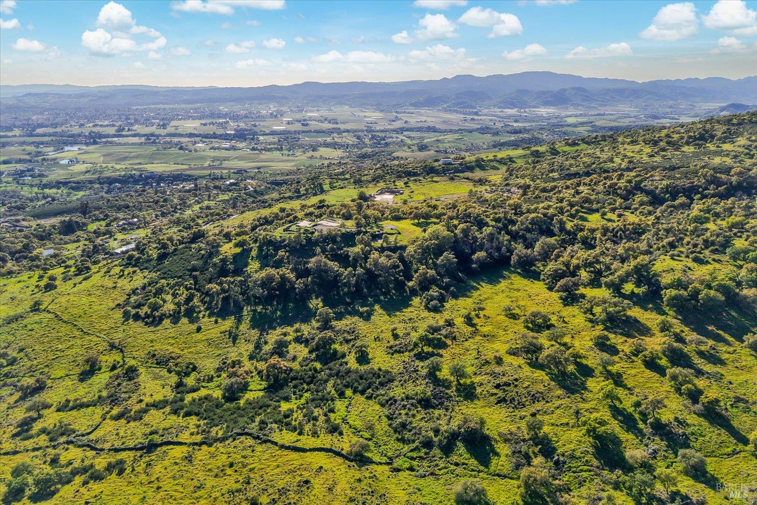 2355 Atlas Peak Road Napa, CA 94558 - Photo 9 of 24 Aerial view looking west over North Napa towards the Mayacamas Mountains