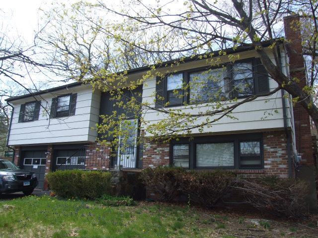 a view of a house with a garden