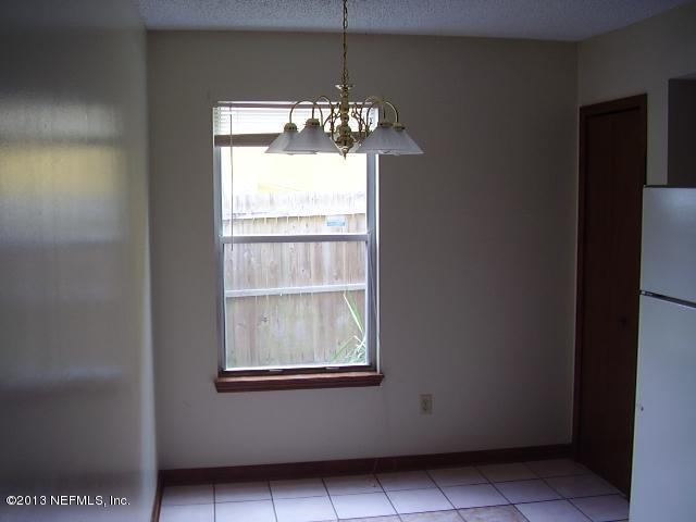 2465 Wattle Tree Road East Jacksonville, FL 32246 - Photo 8 of 11 a room with window and stairs