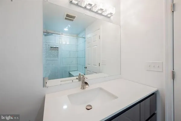 a bedroom with a bed and a chair