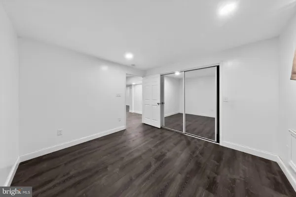 a front view of a house with a snow on the road