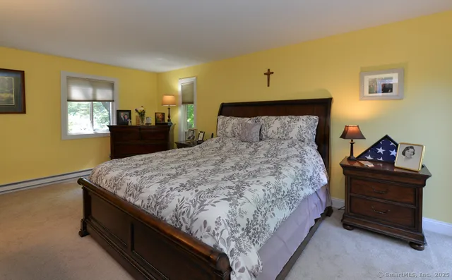 a bedroom with a bed and window