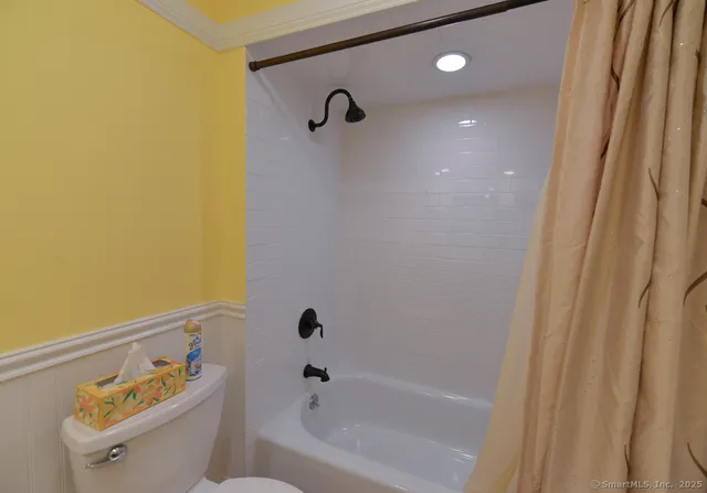 a bathroom with a bathtub and shower