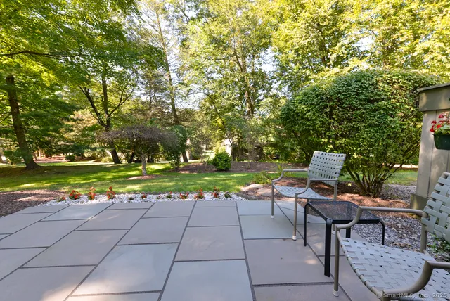 a view of a chairs and tables in the patio