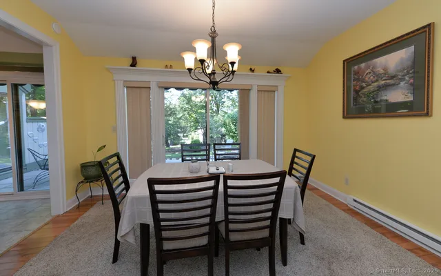 a dining room with furniture and window