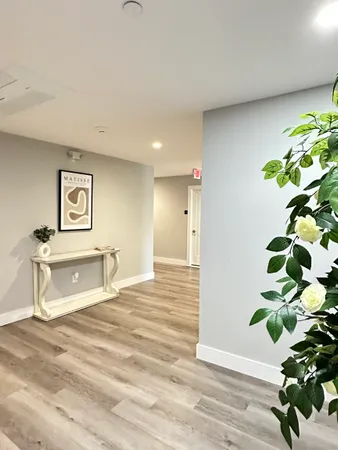 a bathroom with a bathtub sink and mirror