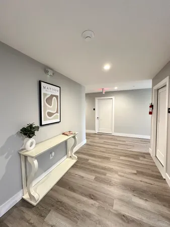 a spacious bedroom with a bed and a table