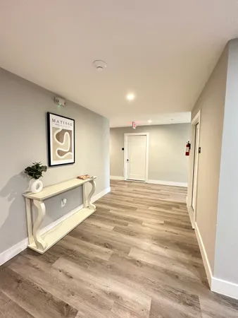 a view of a bathroom with sink shower and mirror