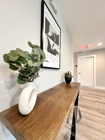 a dining room with furniture and wooden floor
