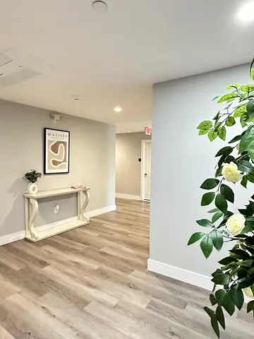a bathroom with a bathtub sink and mirror