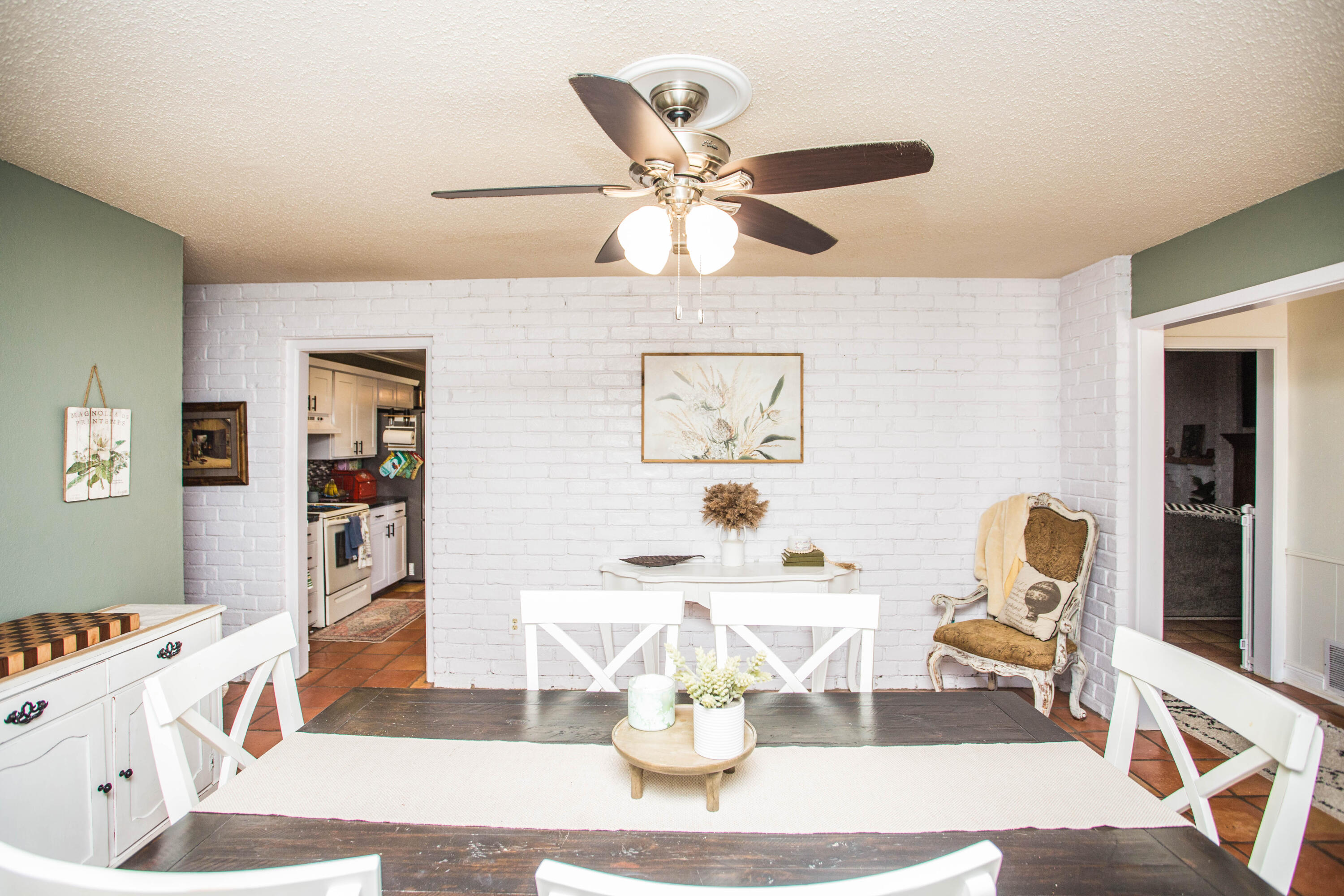 5202 44th Street Lubbock, TX 79414 - Photo 15 of 51 a living room with kitchen island furniture and a chandelier