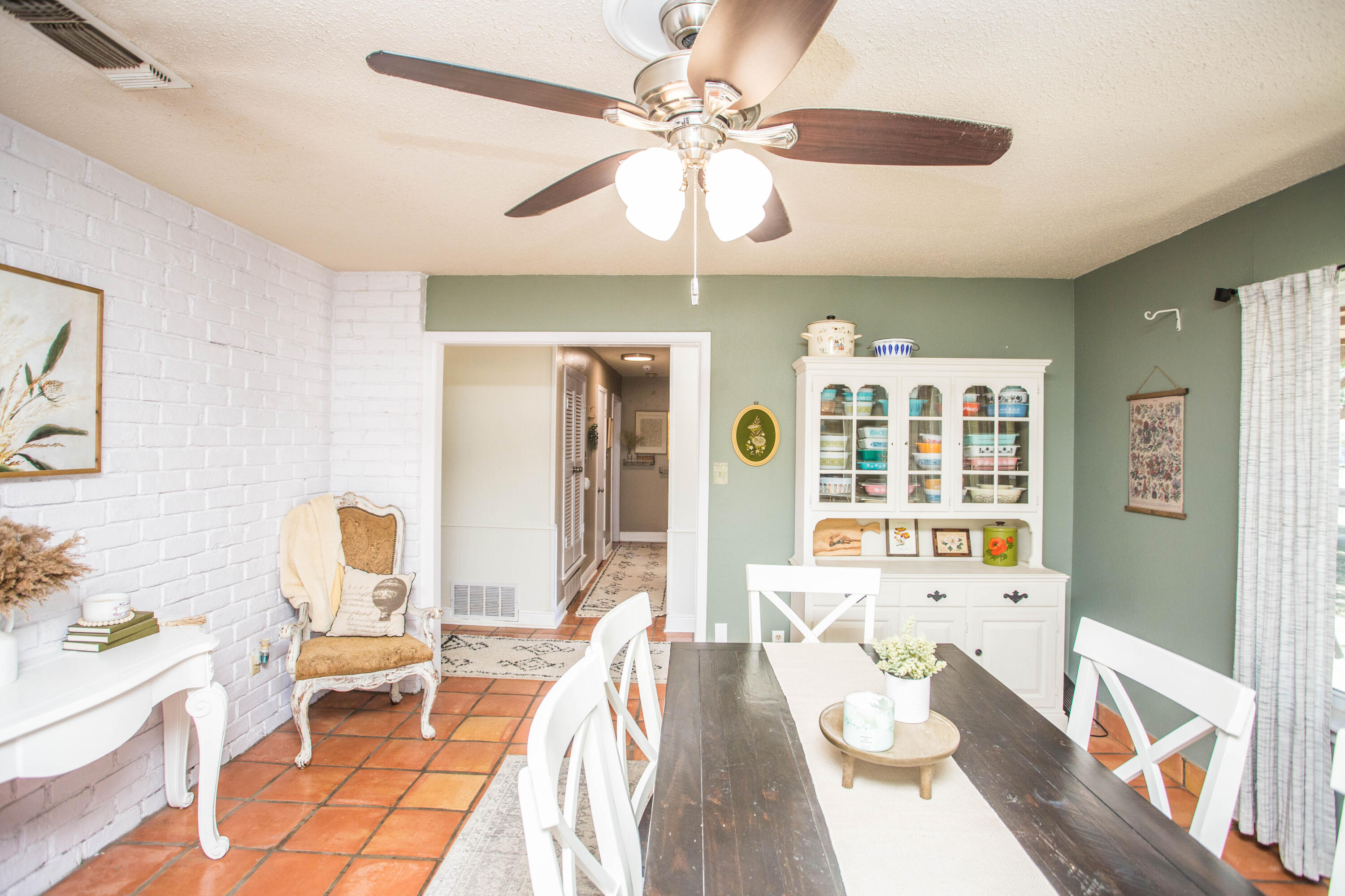 5202 44th Street Lubbock, TX 79414 - Photo 16 of 51 a living room with furniture and a chandelier