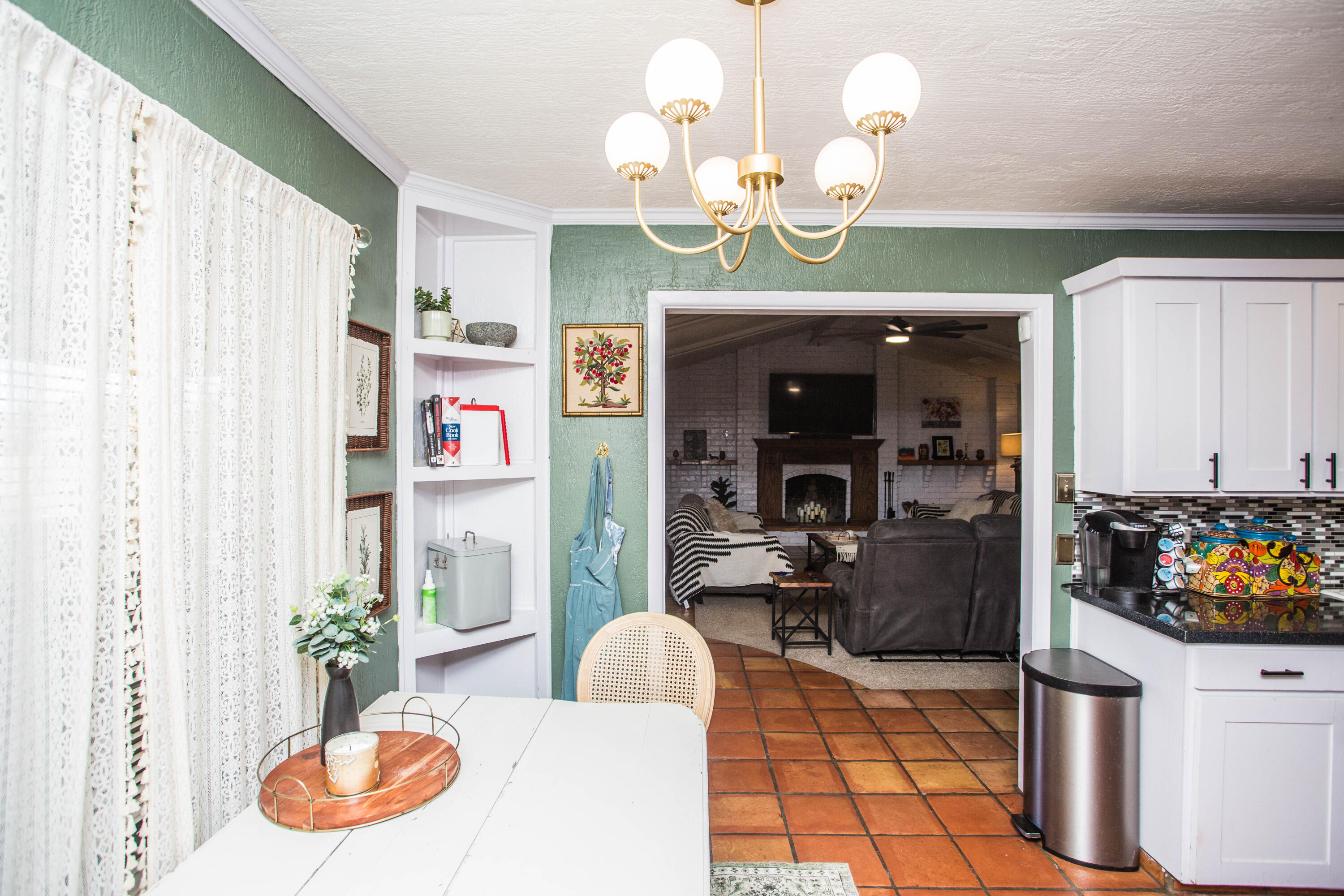 5202 44th Street Lubbock, TX 79414 - Photo 22 of 51 a dining room filled with furniture and a chandelier