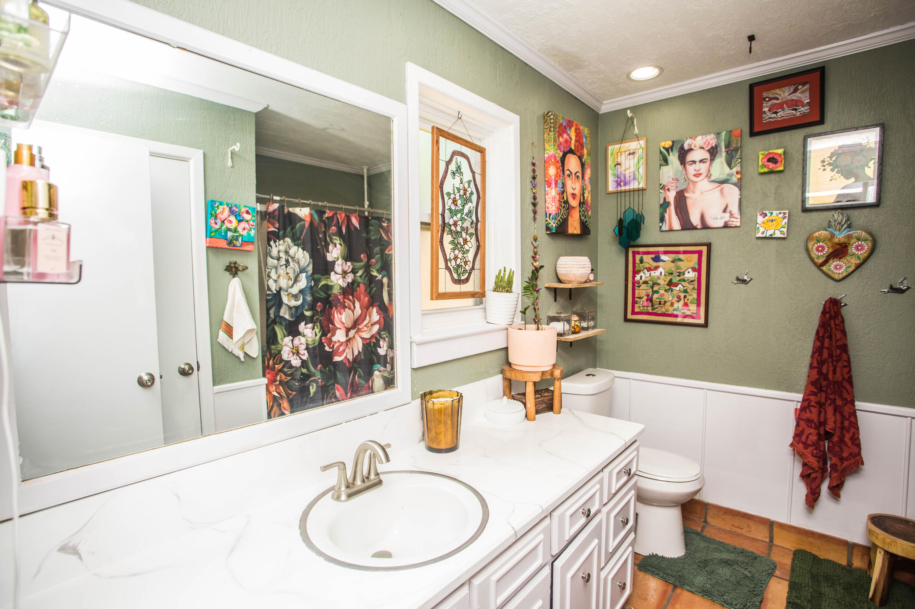 5202 44th Street Lubbock, TX 79414 - Photo 28 of 51 a bathroom with a sink a mirror and a shower