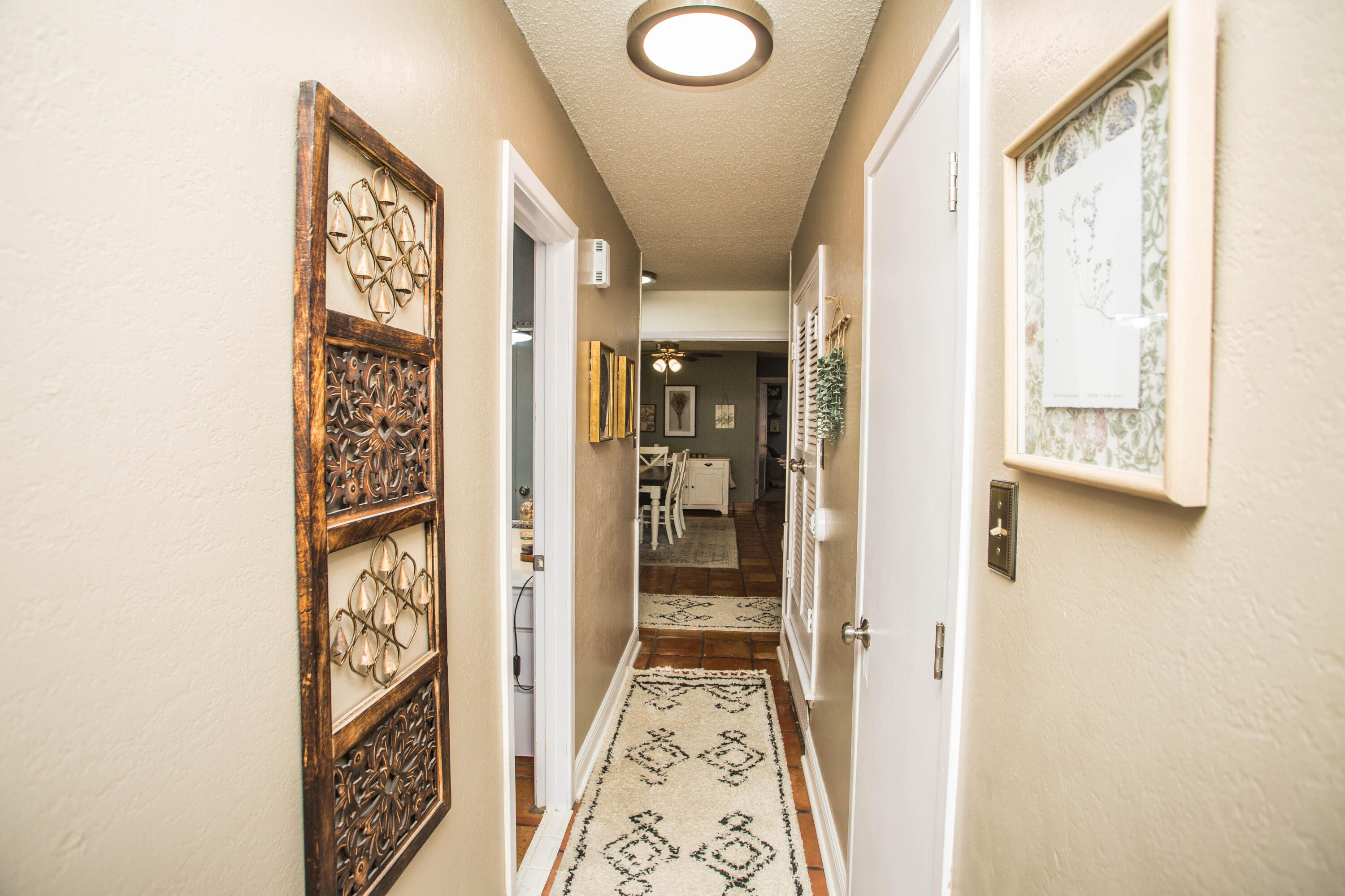 5202 44th Street Lubbock, TX 79414 - Photo 30 of 51 a view of a hallway with paintings on the wall