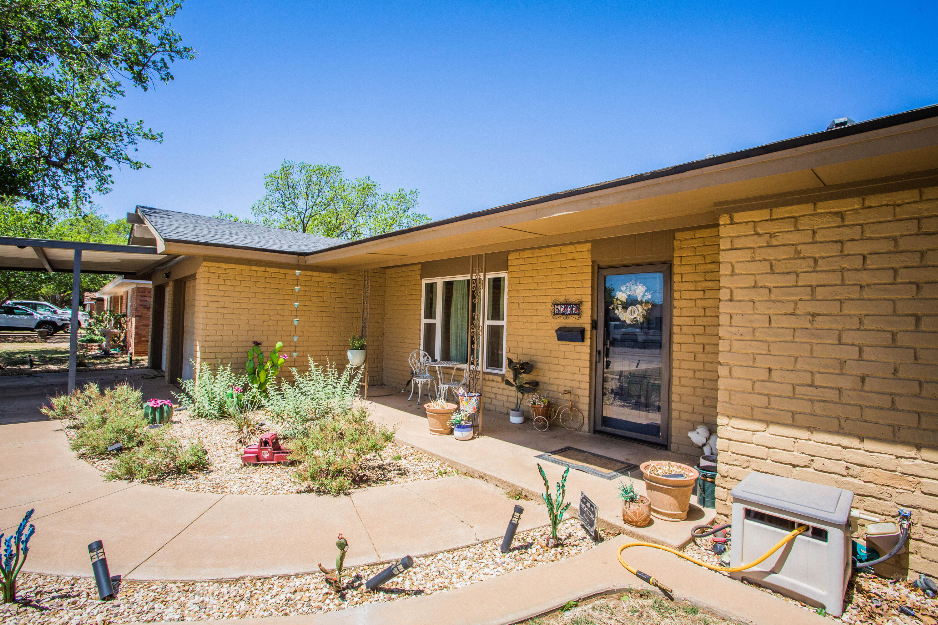 5202 44th Street Lubbock, TX 79414 - Photo 3 of 51 a front view of a house with a patio