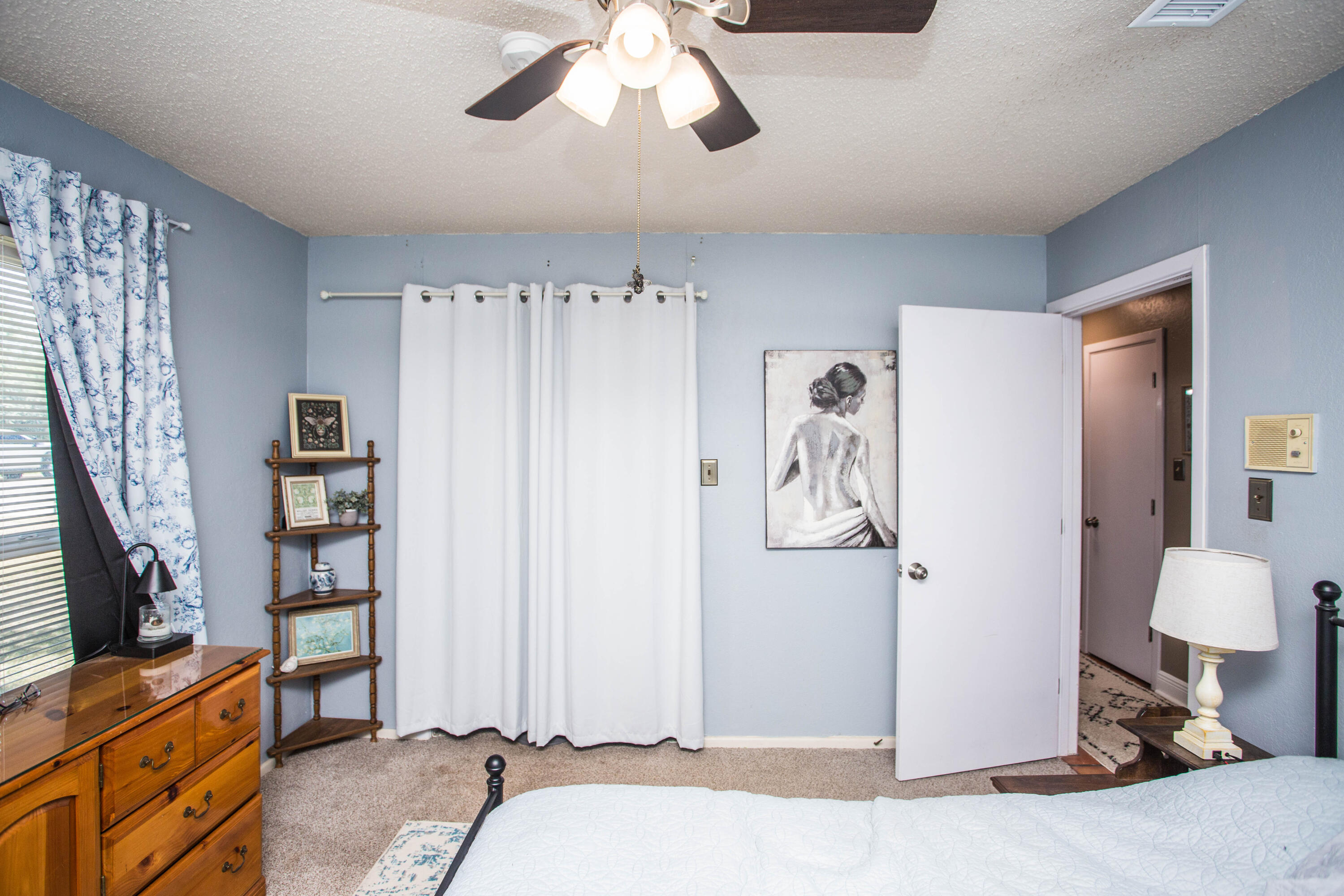 5202 44th Street Lubbock, TX 79414 - Photo 39 of 51 a bedroom with a bed and a couch