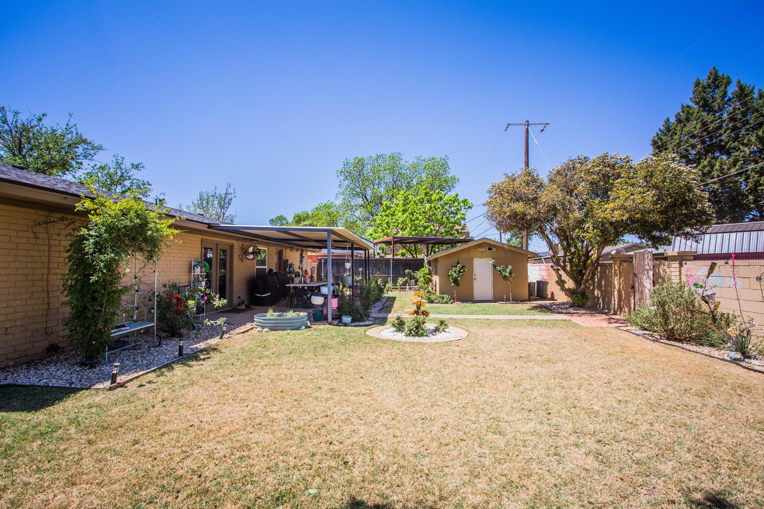 5202 44th Street Lubbock, TX 79414 - Photo 48 of 51 a view of a house with a yard and large trees