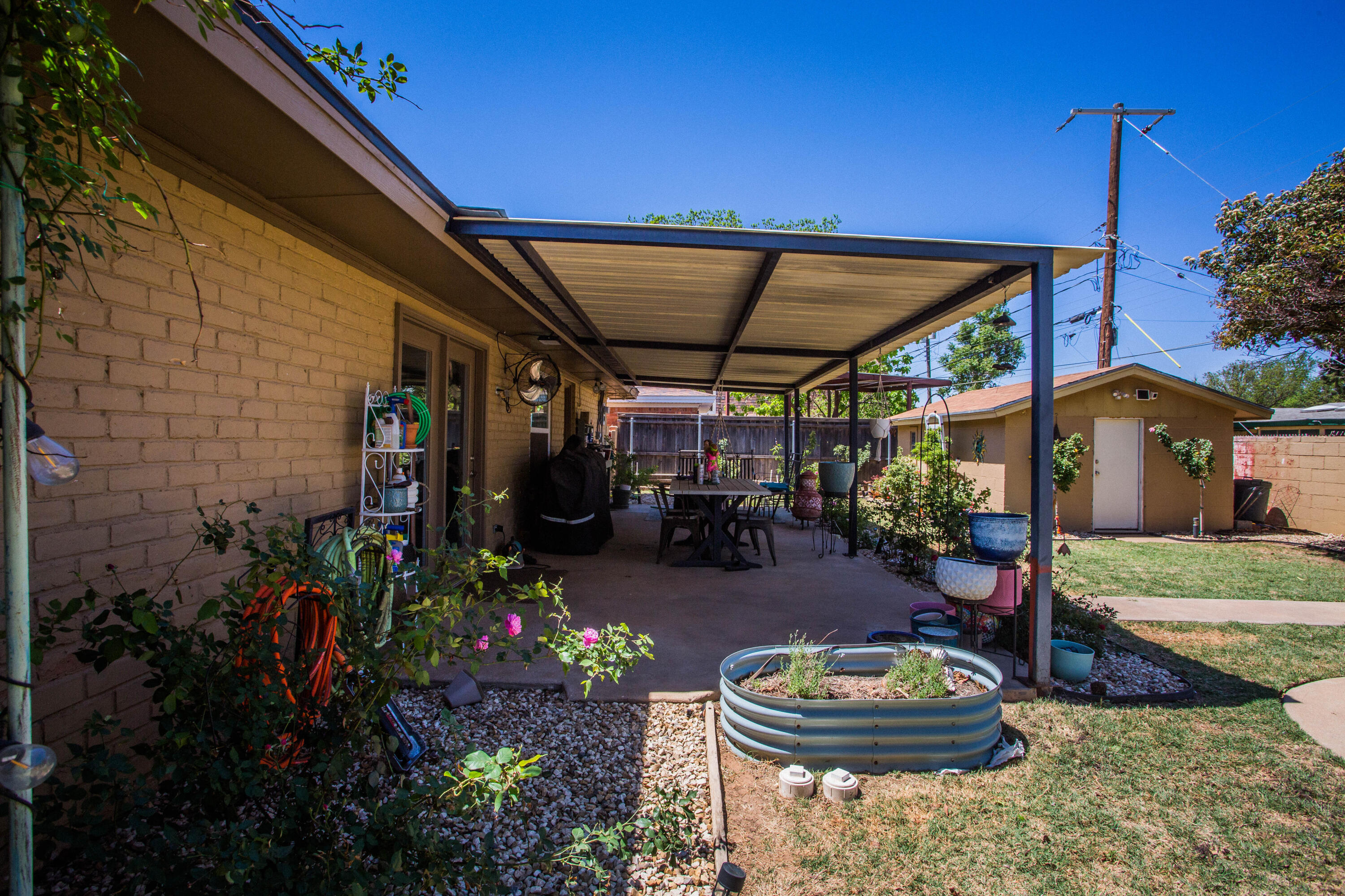 5202 44th Street Lubbock, TX 79414 - Photo 50 of 51 a view of a chairs and tables in backyard
