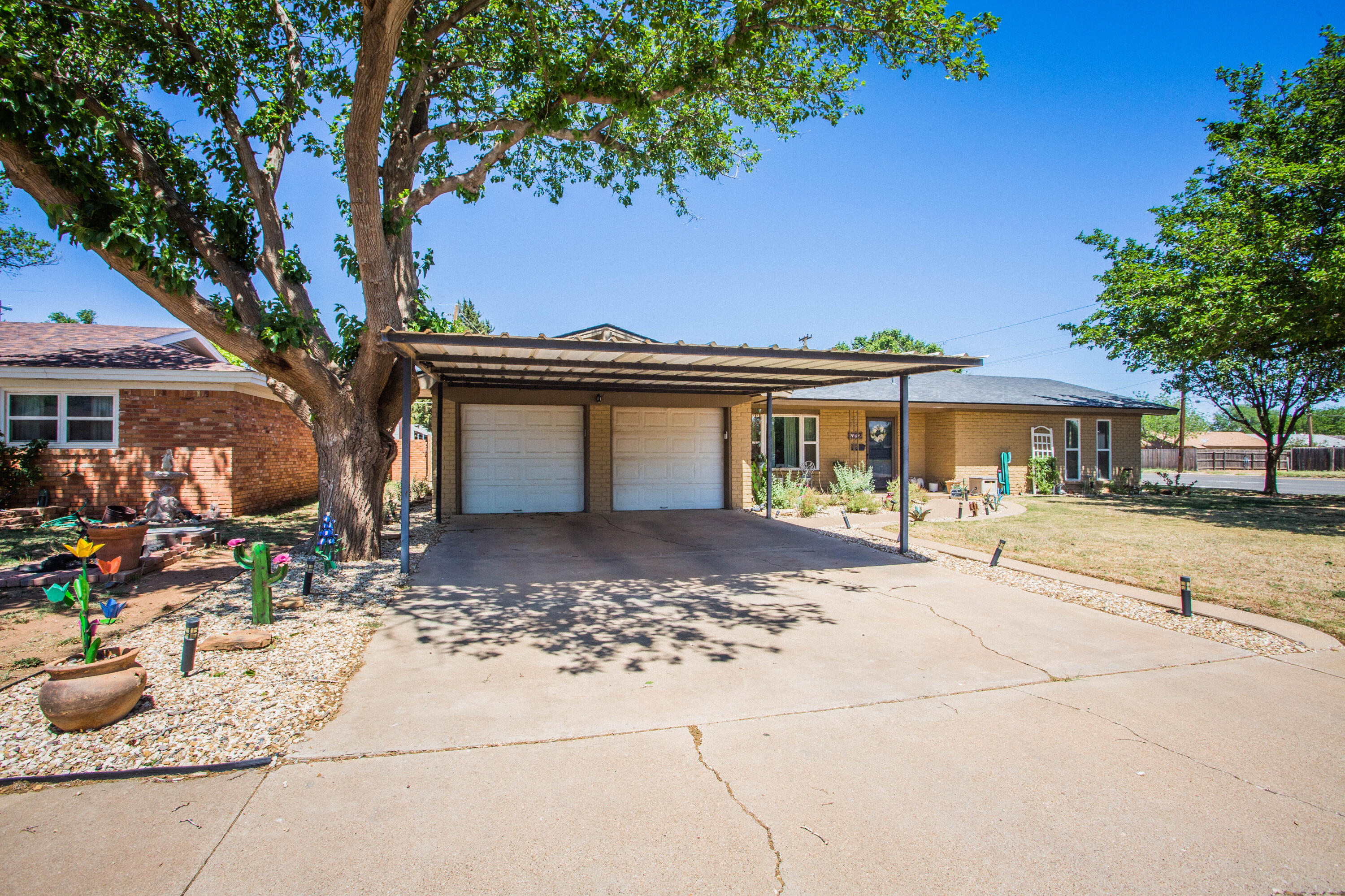 5202 44th Street Lubbock, TX 79414 - Photo 7 of 51 a front view of a house with patio