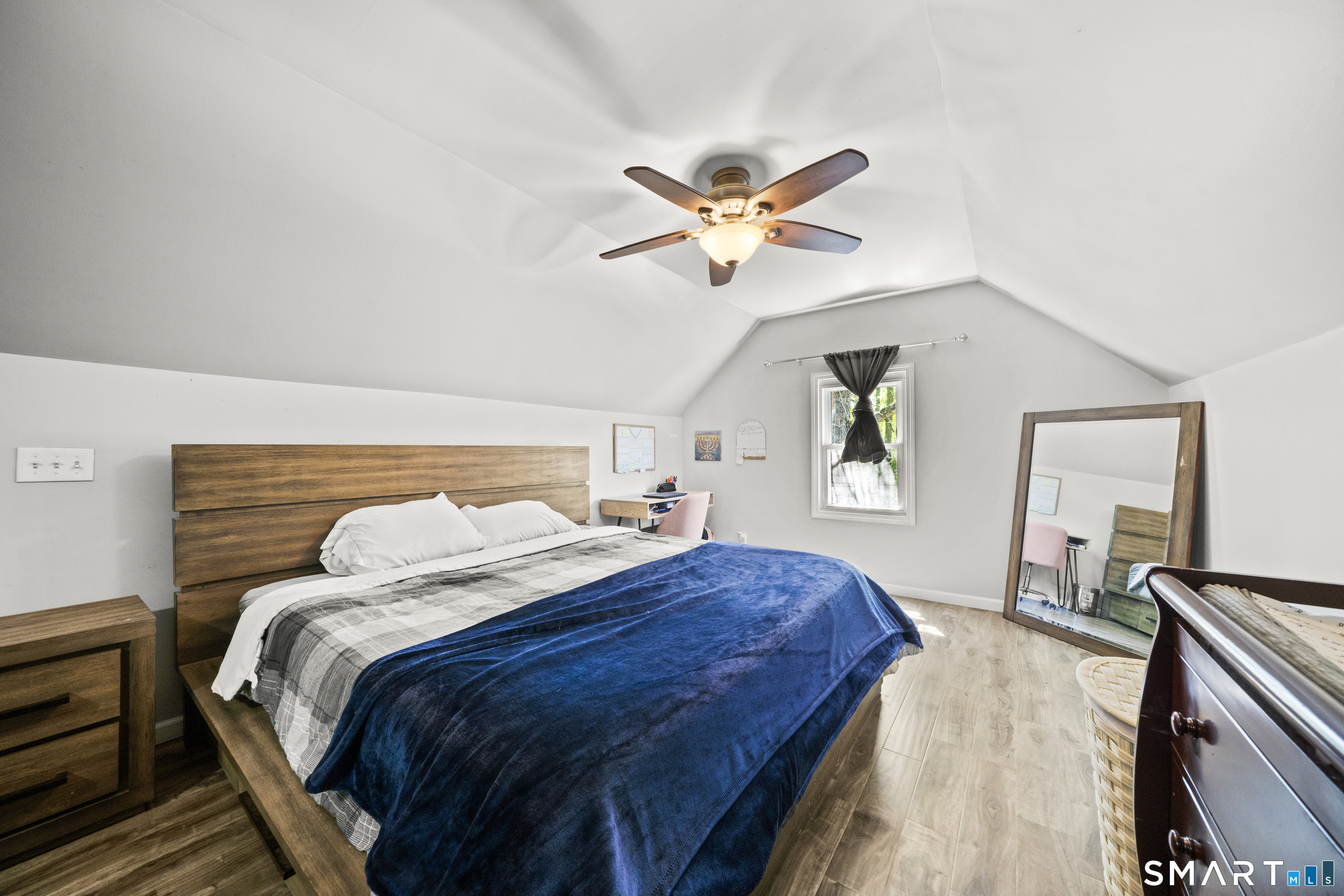14 Church Street Sprague, CT 06330 - Photo 26 of 36 a bedroom with a bed and a chandelier