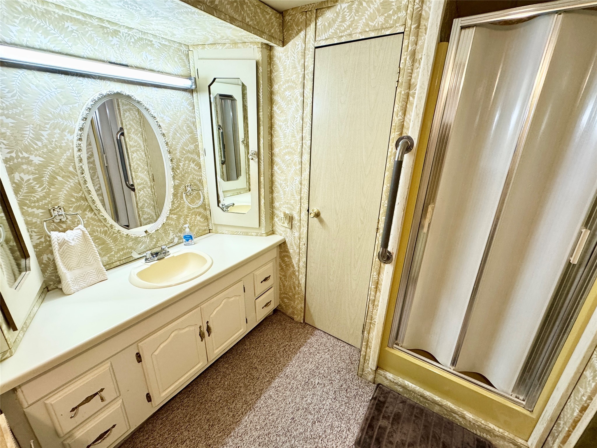 39 Whippoorwill Lane Trinity, TX 75862 - Photo 14 of 27 Lovely vanity and linen closet in private bath.
