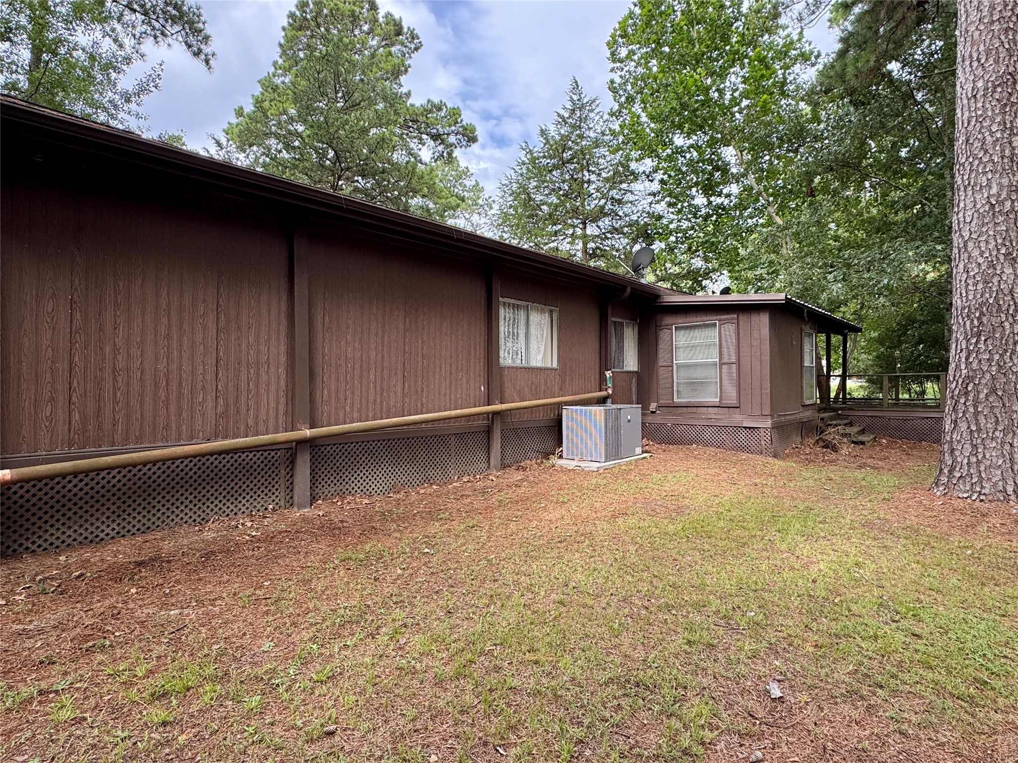 39 Whippoorwill Lane Trinity, TX 75862 - Photo 4 of 27 Covered back porch and open deck.