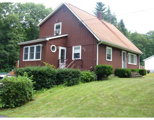 43 Hartness Road Sutton, MA 01590 - Photo 1 of 10 a front view of a house with garden