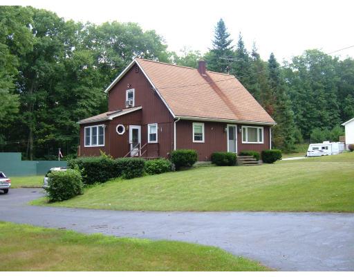 43 Hartness Road Sutton, MA 01590 - Photo 2 of 10 a front view of a house with a yard