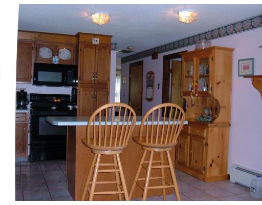 43 Hartness Road Sutton, MA 01590 - Photo 5 of 10 a table chair sitting in a kitchen next to a window