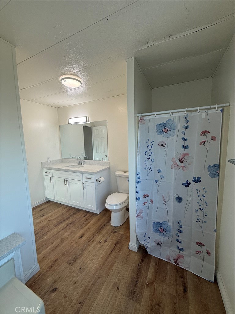 32883 Newberry Road Newberry Springs, CA 92365 - Photo 11 of 14 a bathroom with a granite countertop sink toilet and shower